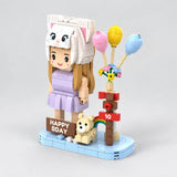 Three-quarter side view of the custom Mini You birthday brick set